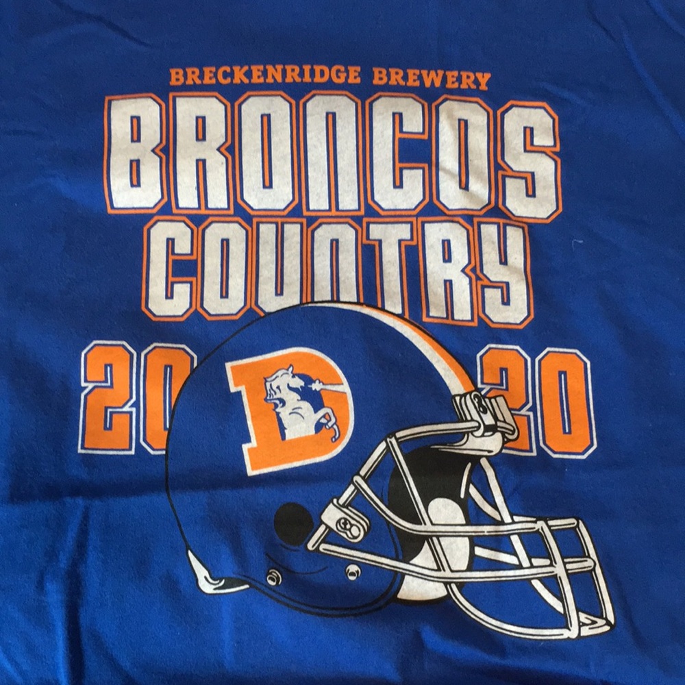 Here’s a never worn Broncos T from Breckenridge Brewery.24”W, 28”L. Men’s XL